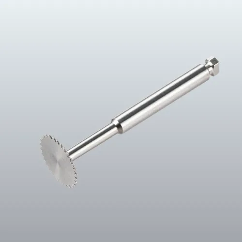 Circular saw blade on a metal mandrel with hex nut at end, used for cutting or trimming materials.